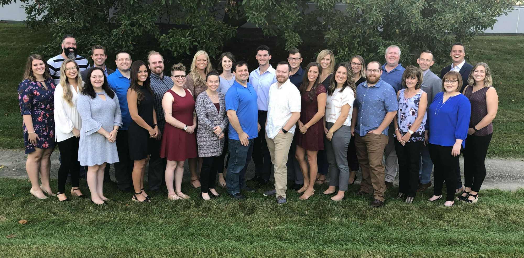 Blue Compass team photo. smiling team photo.